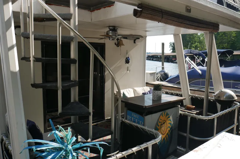 Slide: The Image of Bathroom in 1996 STARDUST Cruiser with sink, mirror, and purple towel. - 34