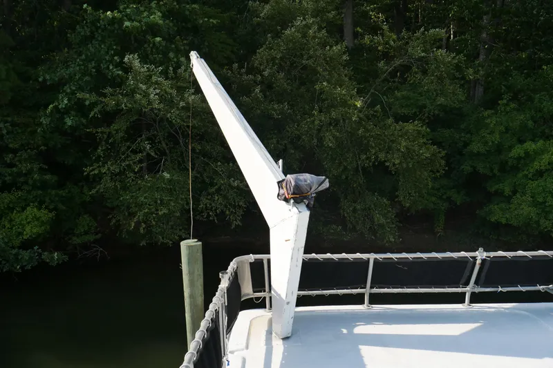 Slide: The Image of 1996 STARDUST Cruiser boat docked, featuring outdoor seating and nautical decor. - 41