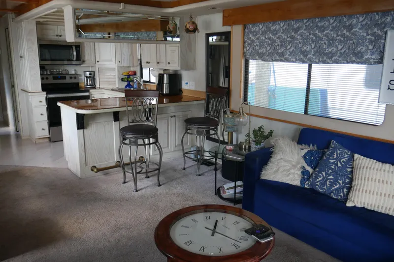 Slide: The Image of Control panel of a 1996 STARDUST Cruiser boat with gauges and steering wheel. - 9