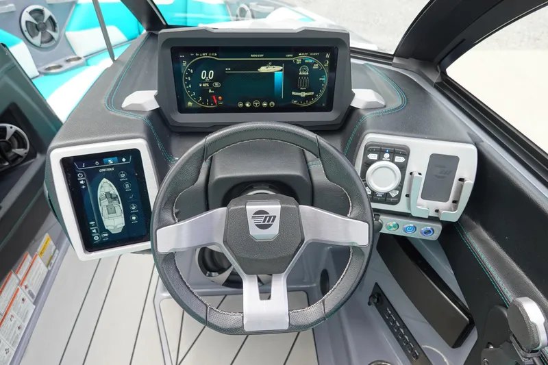 Slide: The Image of 2021 Malibu Wakesetter 22 LSV dashboard with advanced digital controls and steering wheel. - 12