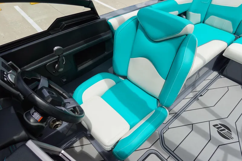 Slide: The Image of 2021 Malibu Wakesetter 22 LSV interior with turquoise and white seating. - 14