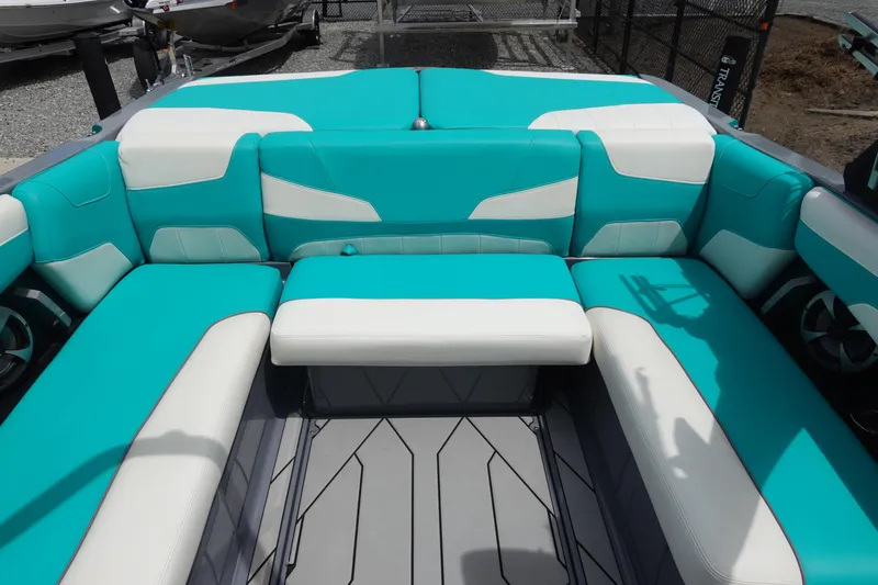 Slide: The Image of 2021 Malibu Wakesetter 22 LSV interior with turquoise and white seating. - 16