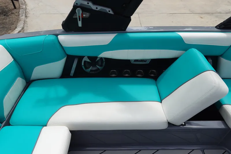 Slide: The Image of 2021 Malibu Wakesetter 22 LSV interior with turquoise and white seating. - 21