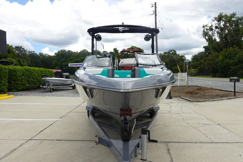 Slide: The Image of 2021 Malibu Wakesetter 22 LSV boat on trailer, parked outdoors, front view. - 3