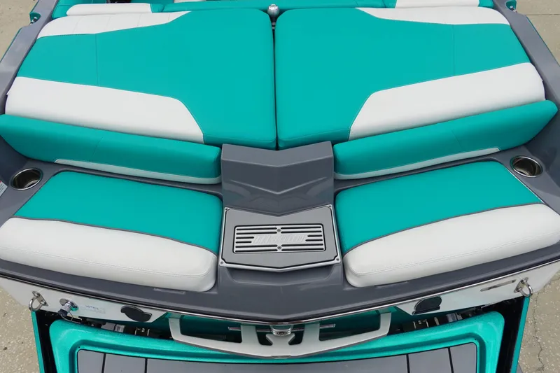 Slide: The Image of 2021 Malibu Wakesetter 22 LSV boat with teal and white cushioned seating. - 8