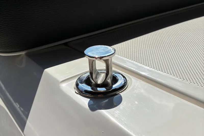 Slide: The Image of Chrome cleat on 2025 Regal LS2 boat deck, close-up view. - 13