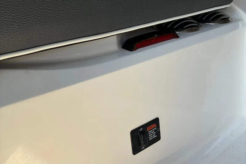 Slide: The Image of 2025 Regal LS2 boat detail showing rear light and control panel. - 14