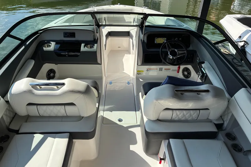 Slide: The Image of 2025 Regal LS2 boat interior with luxurious seating and modern dashboard design. - 18
