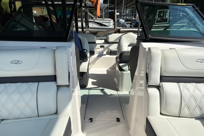 Slide: The Image of 2025 Regal LS2 boat interior with luxurious white seating and modern design. - 20