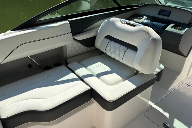 Slide: The Image of 2025 Regal LS2 boat interior with luxurious white seating and modern dashboard design. - 28