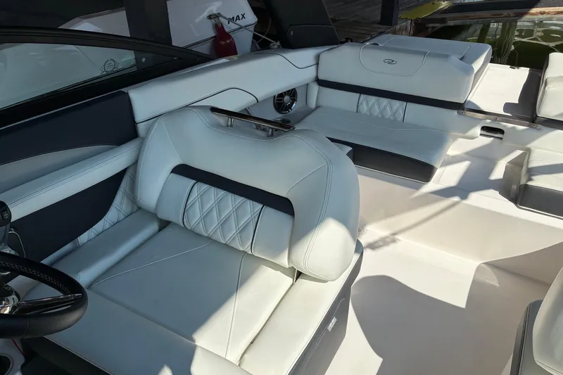 Slide: The Image of Luxurious interior of 2025 Regal LS2 boat with white leather seating. - 31
