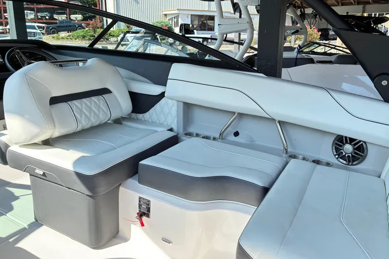 Slide: The Image of 2025 Regal LS2 boat interior with white leather seating and modern design elements. - 32