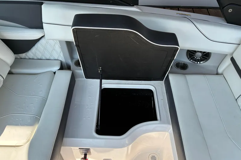 Slide: The Image of 2025 Regal LS2 boat interior with open storage compartment and sleek seating design. - 33