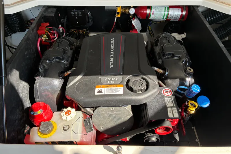 Slide: The Image of Engine compartment of a 2025 Regal LS2 boat featuring a Volvo Penta 280 V6 engine. - 35