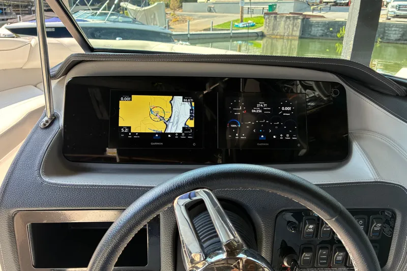 Slide: The Image of Dashboard of 2025 Regal LS2 boat with Garmin navigation displays. - 36