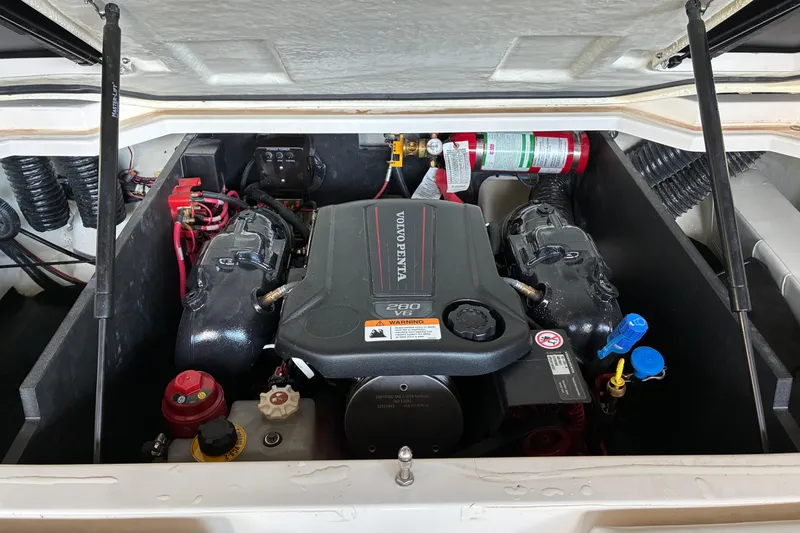 Slide: The Image of Engine compartment of 2025 Regal LS2 boat, featuring Volvo Penta V6 engine. - 37