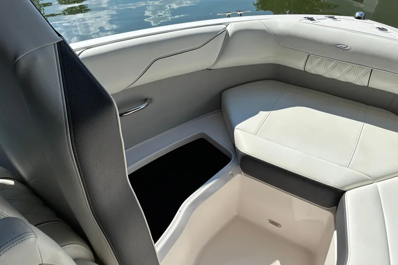 Slide: The Image of Luxurious interior of 2025 Regal LS2 boat with elegant seating and storage. - 38