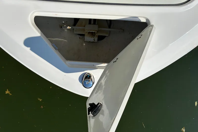 Slide: The Image of Open storage compartment on 2025 Regal LS2 boat, showing interior details. - 40