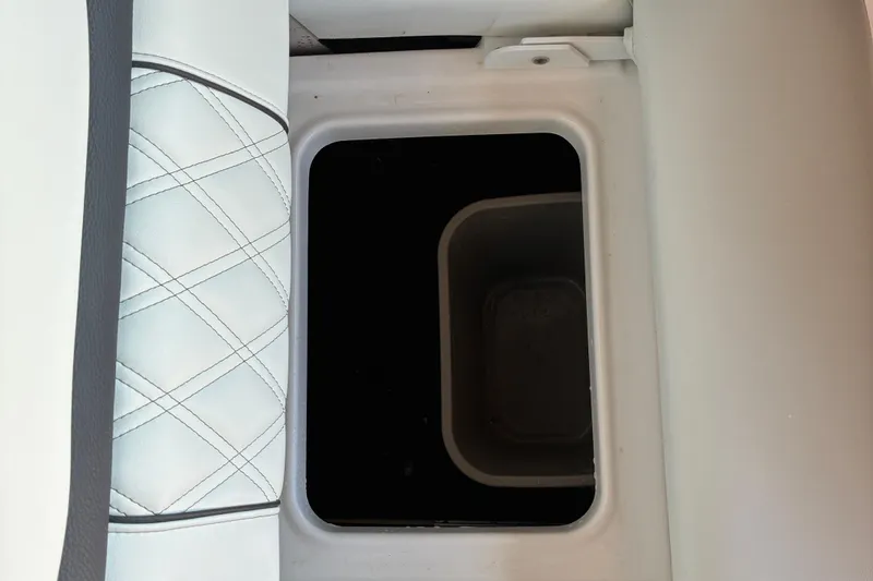 Slide: The Image of 2025 Regal LS2 boat storage compartment with quilted white leather seating. - 41