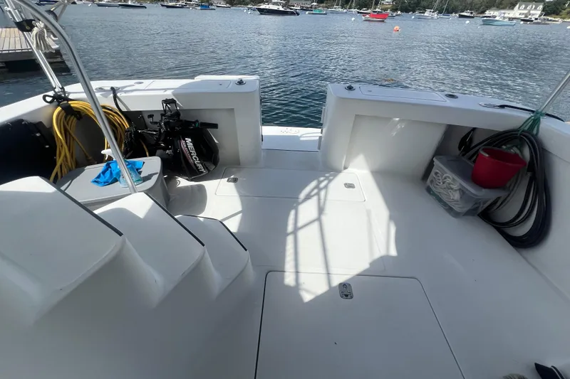 Slide: The Image of 2001 Mainship 390 Trawler deck with equipment, docked in a scenic marina. - 20