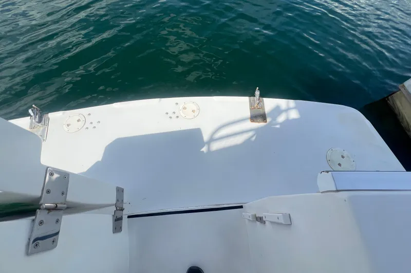 Slide: The Image of 2001 Mainship 390 Trawler stern view with water backdrop. - 21