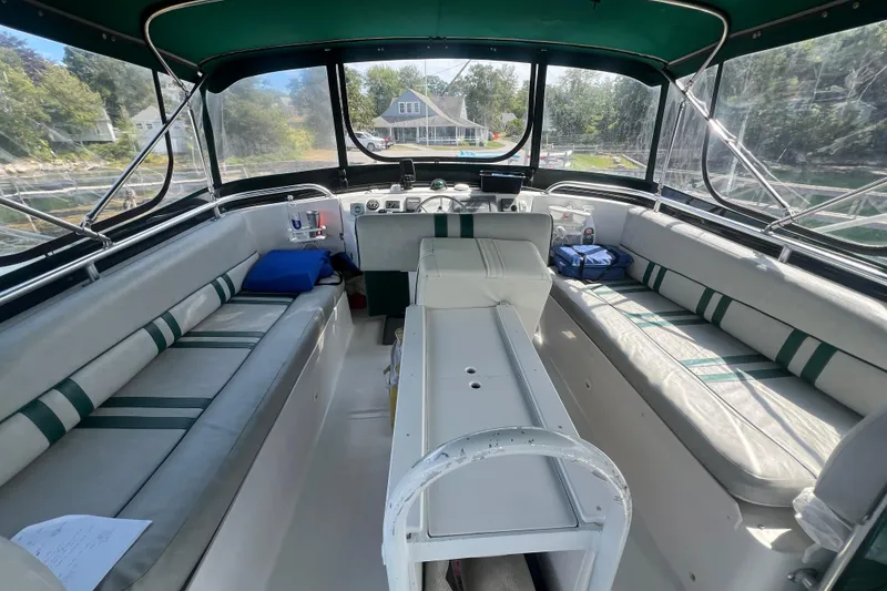 Slide: The Image of Interior view of 2001 Mainship 390 Trawler with seating and helm station. - 27