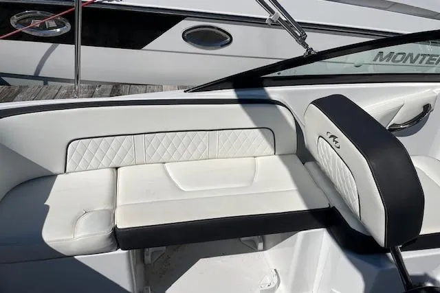 Slide: The Image of White leather seating on a 2017 Monterey M-45 boat, featuring quilted design. - 10