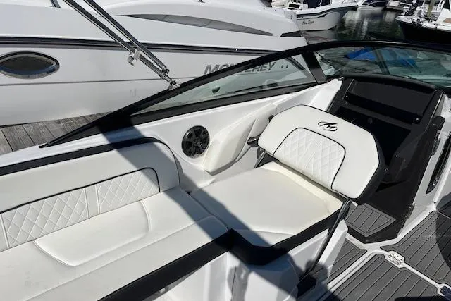 Slide: The Image of 2017 Monterey M-45 boat interior with white seating and sleek design. - 11