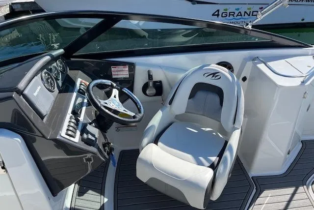 Slide: The Image of Cockpit of a 2017 Monterey M-45 boat with steering wheel and captain's chair. - 13