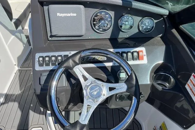 Slide: The Image of Steering wheel and dashboard of a 2017 Monterey M-45 boat with Raymarine equipment. - 15