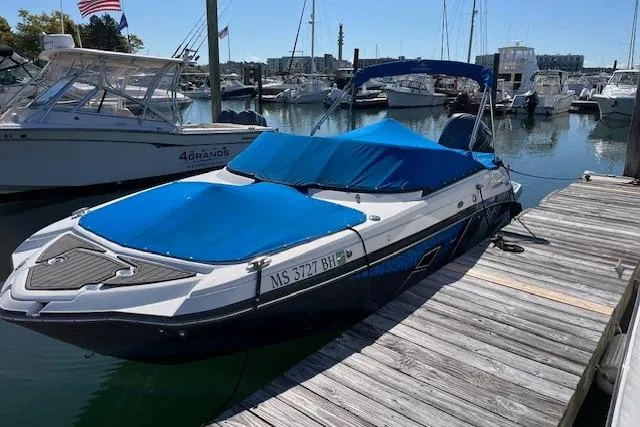 Slide: The Image of 2017 Monterey M-45 boat docked with blue cover in a marina. - 2