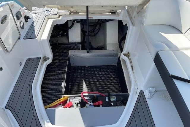 Slide: The Image of Open engine compartment of 2017 Monterey M-45 boat, showing battery and wiring. - 23