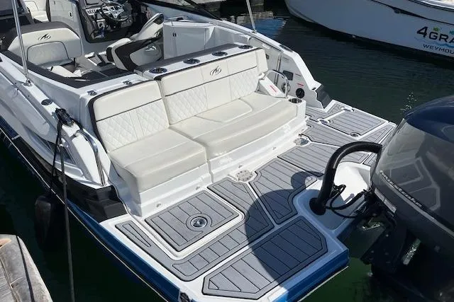 Slide: The Image of 2017 Monterey M-45 boat with spacious seating and modern deck design. - 6