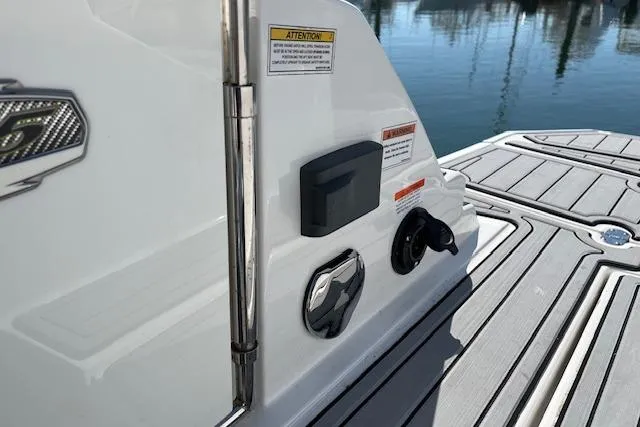 Slide: The Image of 2017 Monterey M-45 boat deck with control panel and warning labels. - 7