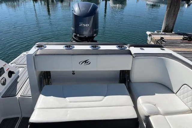 Slide: The Image of 2017 Monterey M-45 boat with Yamaha 250 engine, docked on calm water. - 9