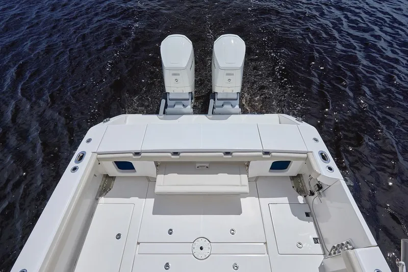 Slide: The Image of 2022 Solace 41 CS boat deck with dual engines on water. - 13
