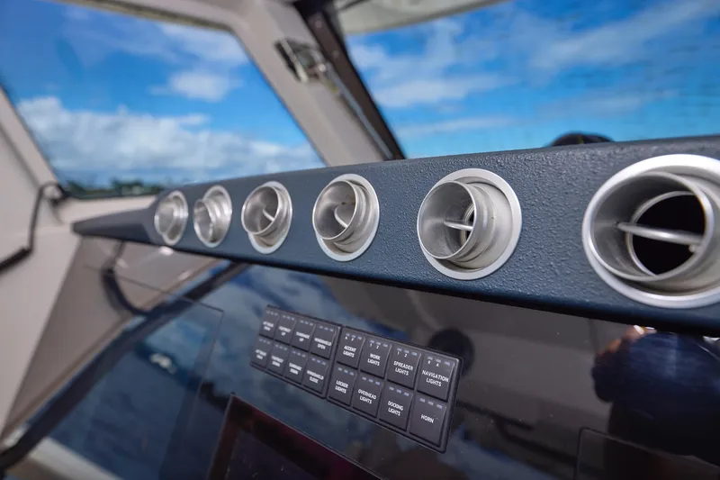 Slide: The Image of Dashboard of 2022 Solace 41 CS boat with air vents and control panel. - 25