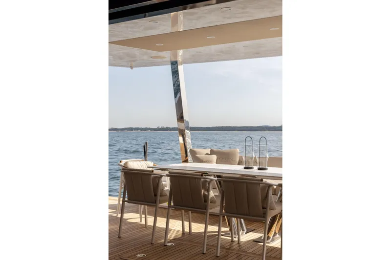 Slide: The Image of Luxury deck of 2026 Moon Yachts 6ty with elegant seating and ocean view. - 10