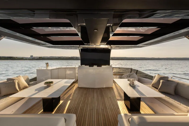 Slide: The Image of Luxurious 2026 Moon Yachts 6ty interior with elegant seating and scenic ocean view. - 13