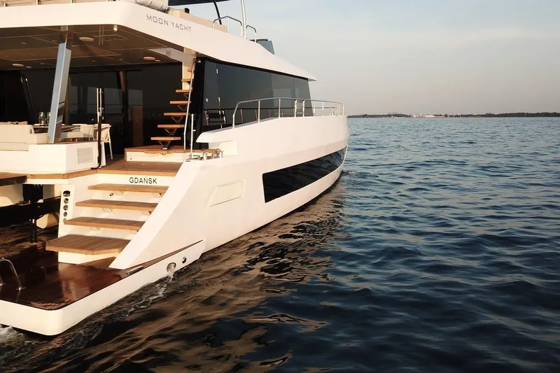 Slide: The Image of Luxurious 2026 Moon Yachts 6ty sailing on calm waters near Gdańsk. - 25