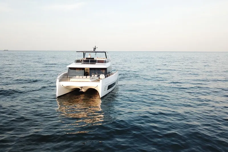 Slide: The Image of Luxury Moon Yachts 6ty 2026 model cruising on open sea. - 34