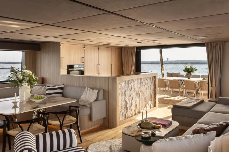 Slide: The Image of Luxurious interior of 2026 Moon Yachts 6ty, featuring elegant dining and lounge areas with ocean views. - 5