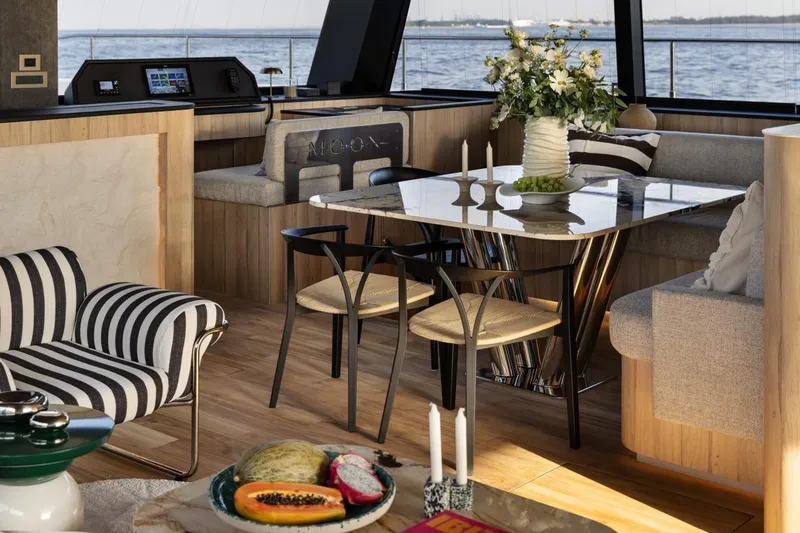Slide: The Image of Luxurious interior of 2026 Moon Yachts 6ty, featuring elegant dining area and modern decor. - 6