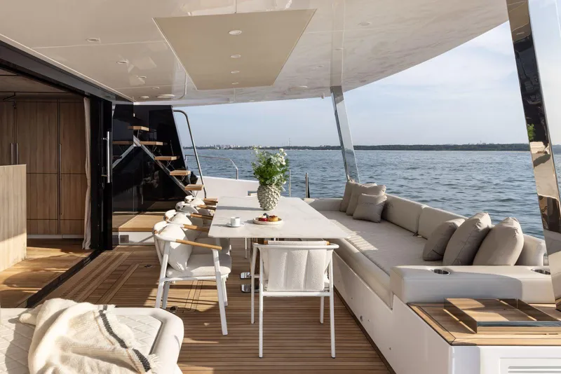 Slide: The Image of Luxurious 2026 Moon Yachts 6ty with elegant outdoor dining area and ocean view. - 9
