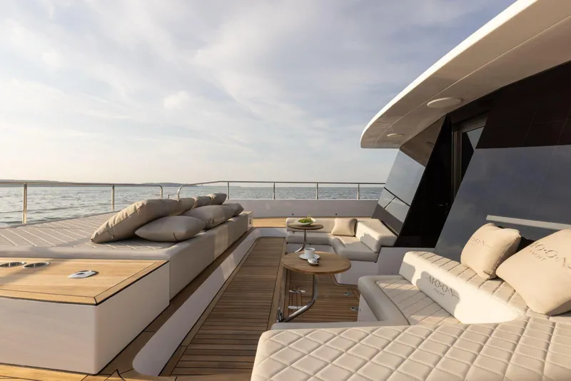 Slide: The Image of Luxurious 2026 Moon Yachts 6ty deck with elegant seating and ocean view. - 12