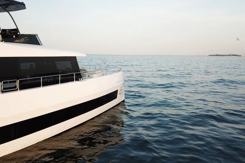 Slide: The Image of Luxury Moon Yachts 6ty 2026 model cruising on calm ocean waters. - 4