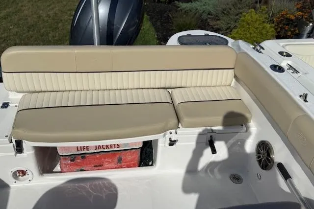 Slide: The Image of 2018 Sea Fox 226 Traveler boat interior with beige seating and life jackets storage. - 17