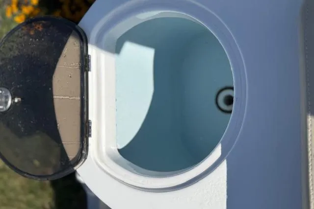 Slide: The Image of Open storage compartment on 2018 Sea Fox 226 Traveler boat, featuring a black lid. - 18