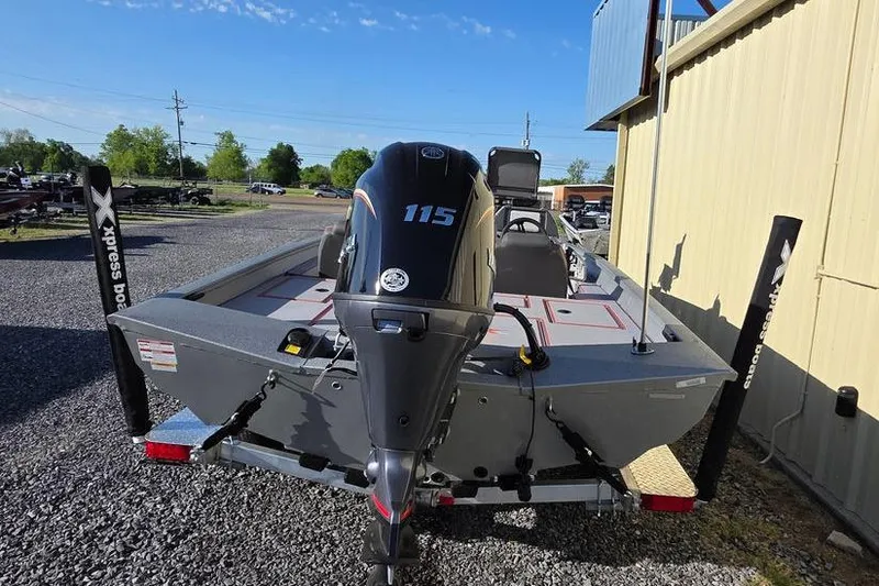 Slide: The Image of 2025 Xpress H18C Crappie boat with 115 HP motor, parked outdoors. - 10