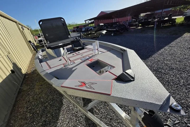 Slide: The Image of 2025 Xpress H18C Crappie fishing boat on trailer, featuring sleek design and modern amenities. - 13